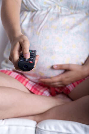 Vertical view of watching tv during pregnancy