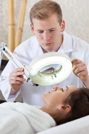 Woman before facial scrub in spa, vertical