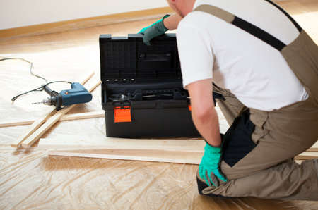 Horizontal view of a handyman during house renovation