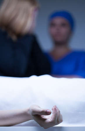 Vertical view of corpse identification in morgue