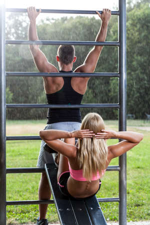 Image of fit people training in park