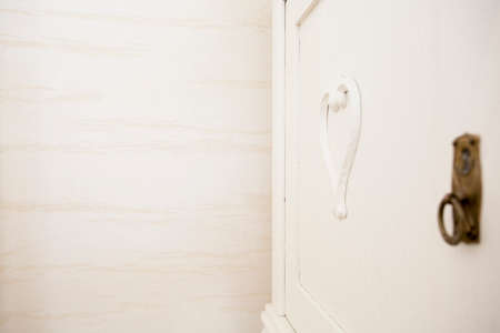 Horizontal view of close-up of white door