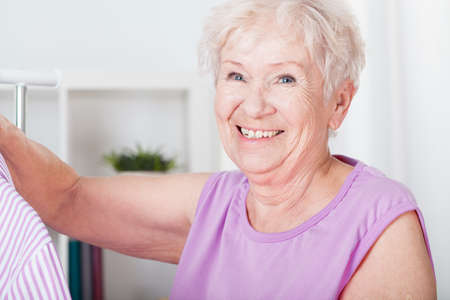Portrait of smiling elderly woman with gray hairの写真素材