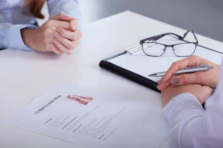 Close-up of woman's application on the desk