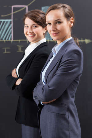 Portrait of elegant businesswomen working in officeの写真素材