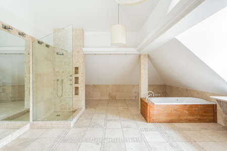Deisgn of rock bathroom with wooden bathtubの写真素材