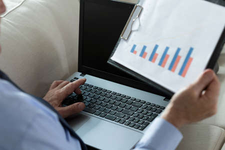 Elderly businessman checking the survey result