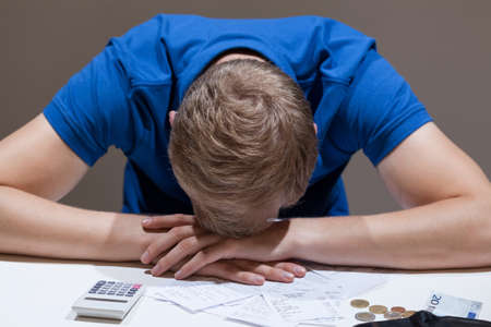Frustrated man not having money to pay bills