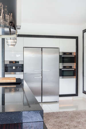 Modern kitchen interior with stainless steel refrigeratorの写真素材