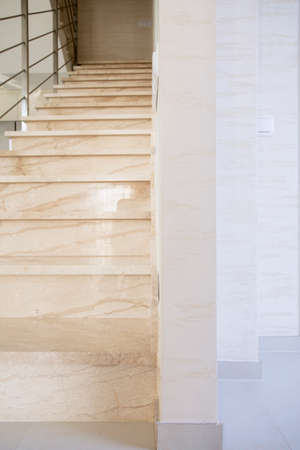 Vertical view of marble stairs in luxury apartmentの写真素材