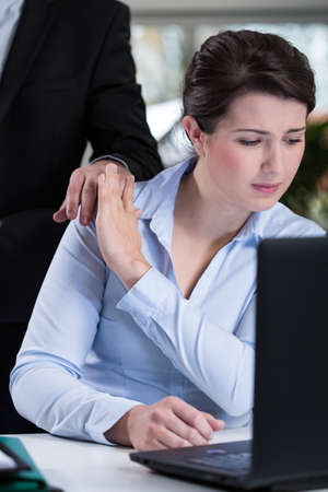 Male boss and young attractive woman's refusalの写真素材