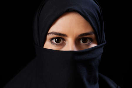 Portrait of muslim woman on black backgroundの写真素材