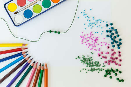 Photo of splitted beading on the white deskの写真素材