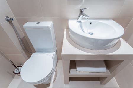 Esthetic toilet with white basin in luxury bathroomの写真素材