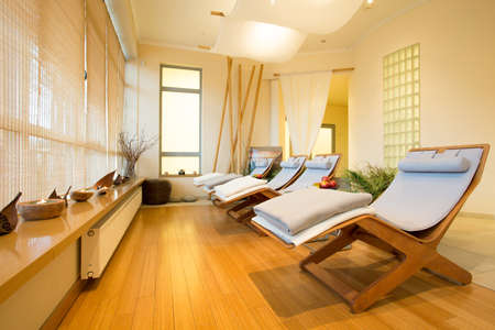 Close-up of loungers in cozy spa room