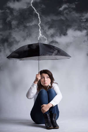 woman during storm with an umbrella
