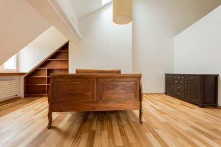 View of vintage bed in the attic