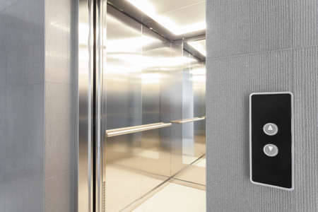 Close-up of entry to elevator in modern buildingの写真素材