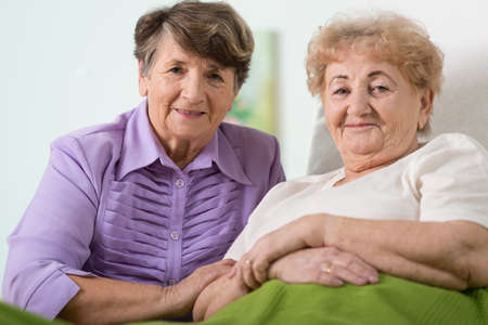 Portrait of two happy elderly friendsの写真素材