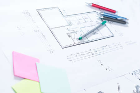 Pens and architectural drawings on paper