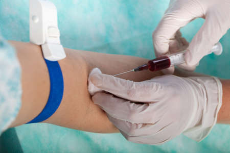 Close-up of nurse taking blood sample