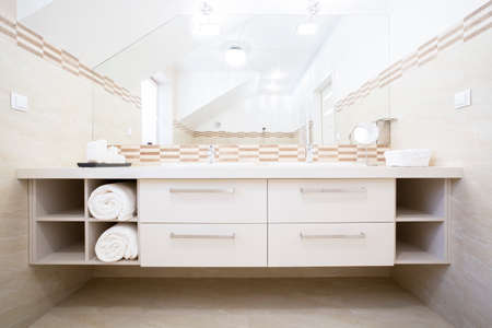 View of white furniture in bright bathroomの写真素材