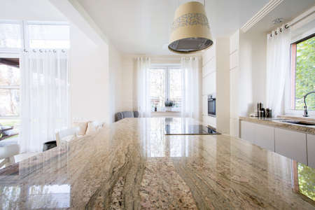 Granite worktop inside white light apartmentの写真素材