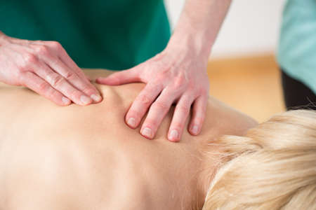 Close-up of rubbing the muscles during the massageの写真素材