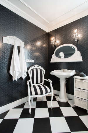 Luxury moden bathroom with white alnd black tilesの写真素材