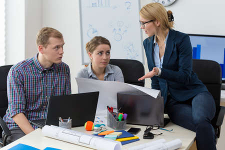 Female team leader being angry on her co-workers