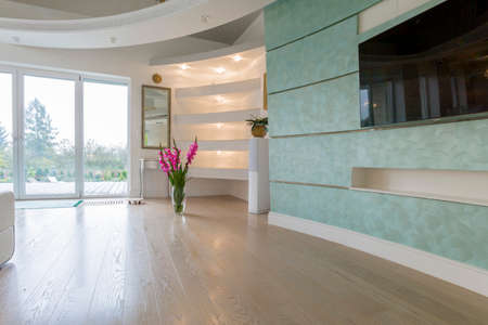 Vase with flowers in drawing room in pastel colorsの写真素材