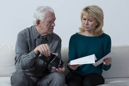 Worried aged marriage checking wallet
