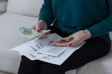 Close-up of woman holding her last savings