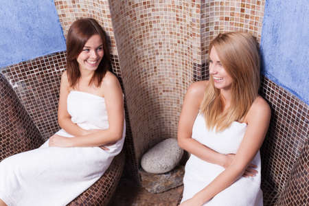 Beauty smiling friends relaxing in wellness centerの写真素材