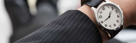Businessman with a watch on his handの写真素材