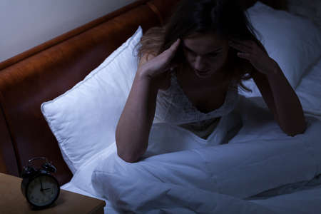 Woman having problems with a sleep, horizontalの写真素材