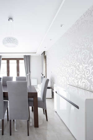 Silver wallpaper in elegant dining room interiorの写真素材