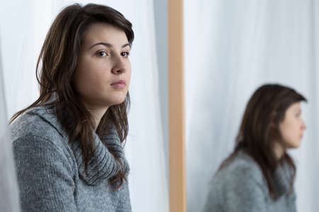 Young attractive woman in a bad moodの写真素材