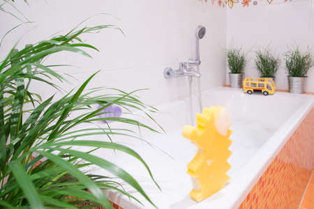 Bath toys for toddler on the bathの写真素材