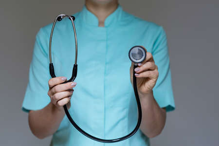 Female doctor is working with stethoscopeの写真素材