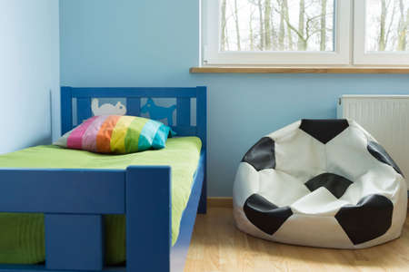 Chair like a soccer ball in cute stylish children roomの写真素材