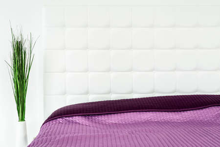 Close-up of white interior with double bedの写真素材