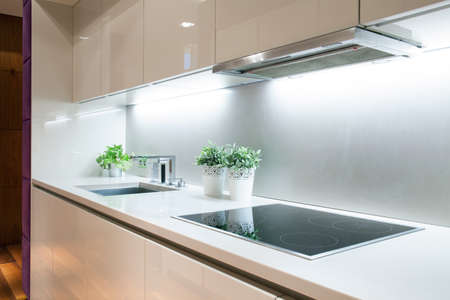 Interior of modern kitchen with induction hobの写真素材