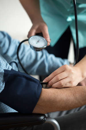 Close-up of senior having measured blood pressureの写真素材