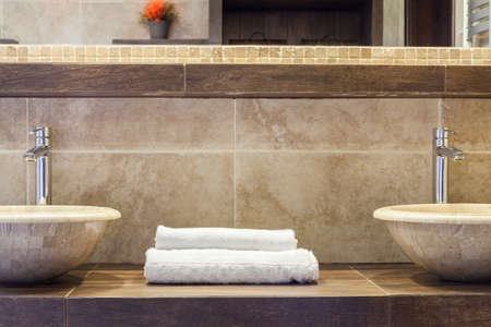 White clean folded towels on marble shelfの写真素材