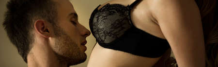 Young handsome man kissing his pretty slim woman