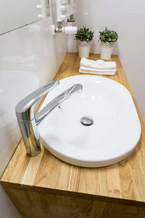 Close-up of ceramic washbowl in modern bathroomの写真素材