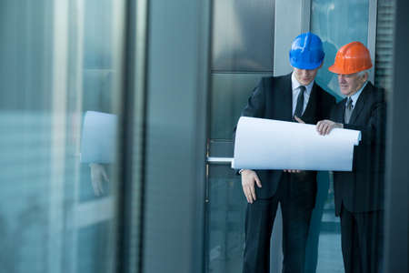 Horizontal view of engineers talking about project