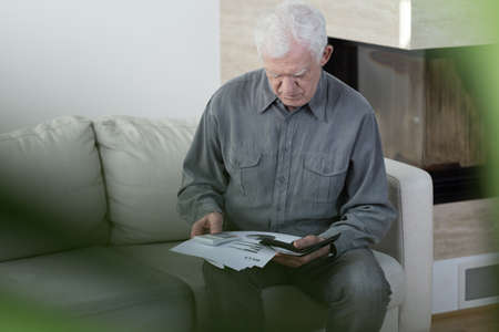 Horizontal view of elder man in bankruptの写真素材