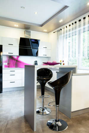 Small table with stools in the new modern open kitchen